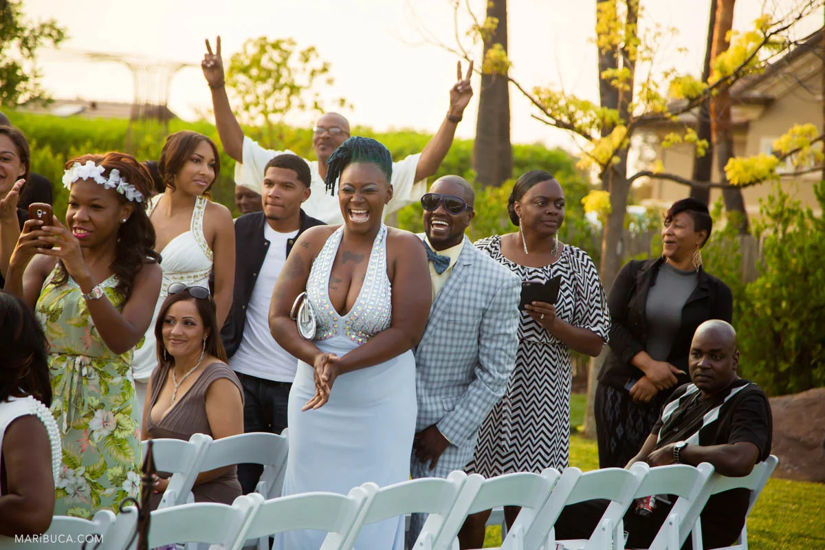 Happy guests so excited are waiting the ceremony and the groom and the bride