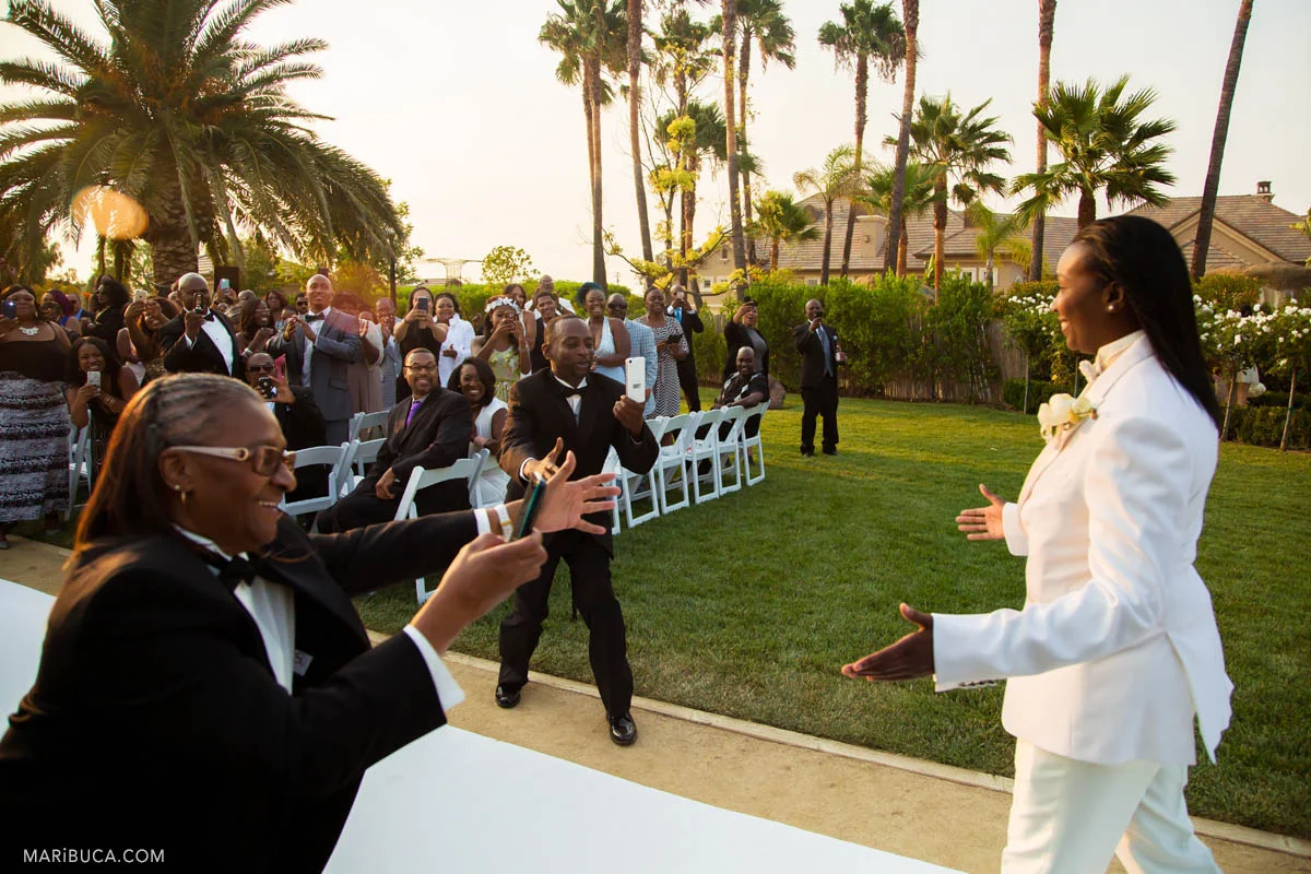 Guests take pictures of the groom before the ceremony in the Newberry Estate Vineyards