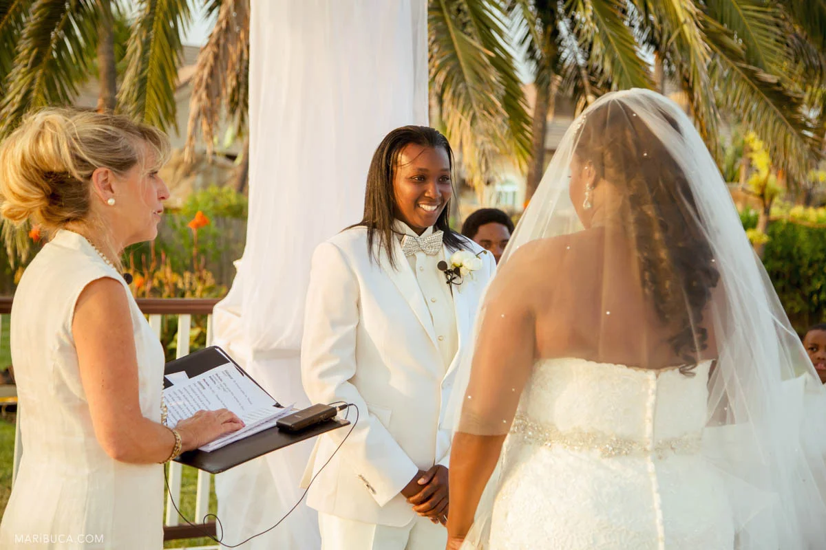 The happy groom looks in her the adorable bride their white wedding ceremony..