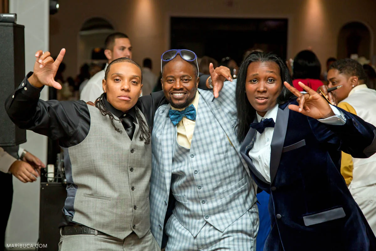 The groom having fun with friends in the wedding