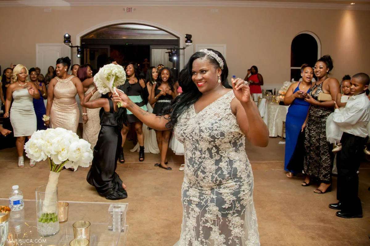 The beautiful bride happy and ready to throw her wedding bouquet.