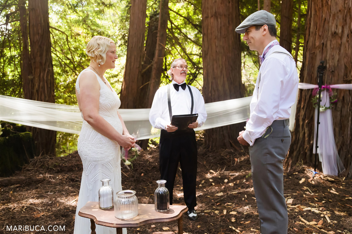 Groom and bride look each other in the ceremony in the Saratoga Springs,, California