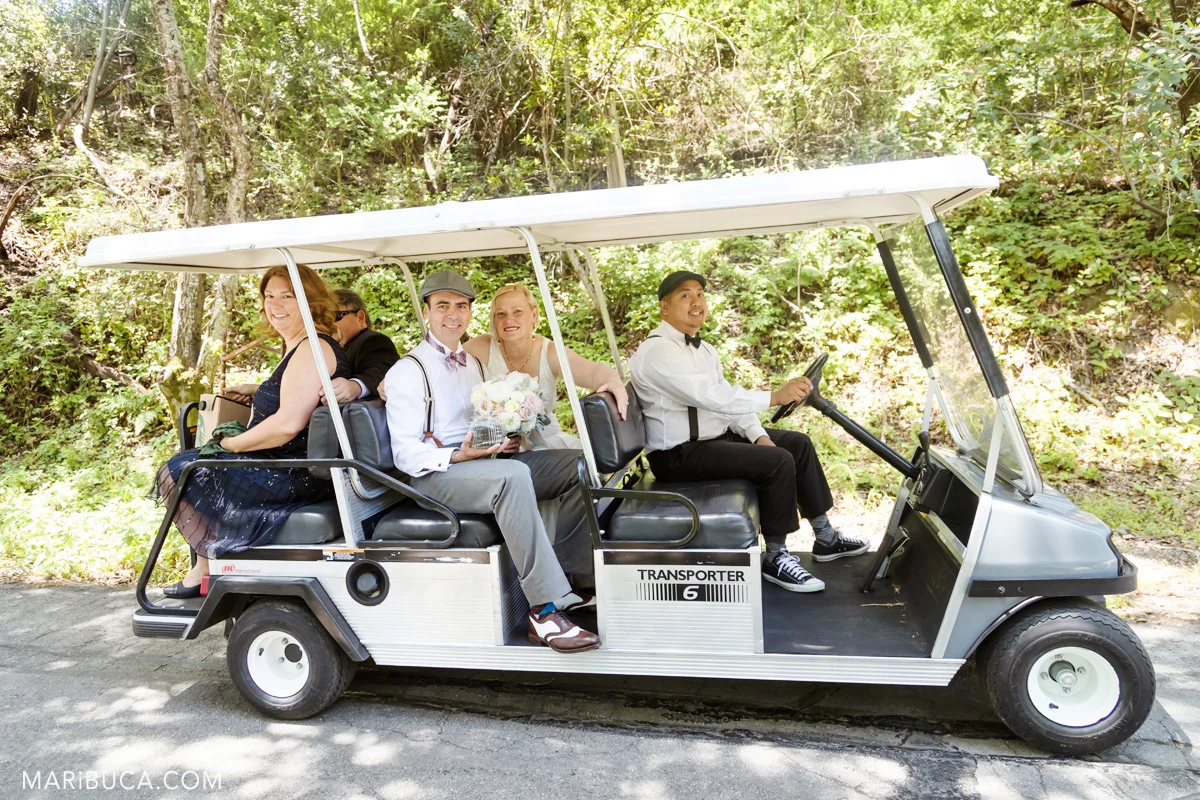 Wedding in the Los Gatos where newlyweds couple with friends use golf cart.