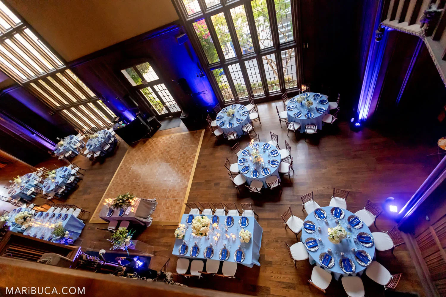 unforgettable view from the second floor to Great Hall, Kohl Mansion, Burlingame as the blue wedding theme for the wedding reception.