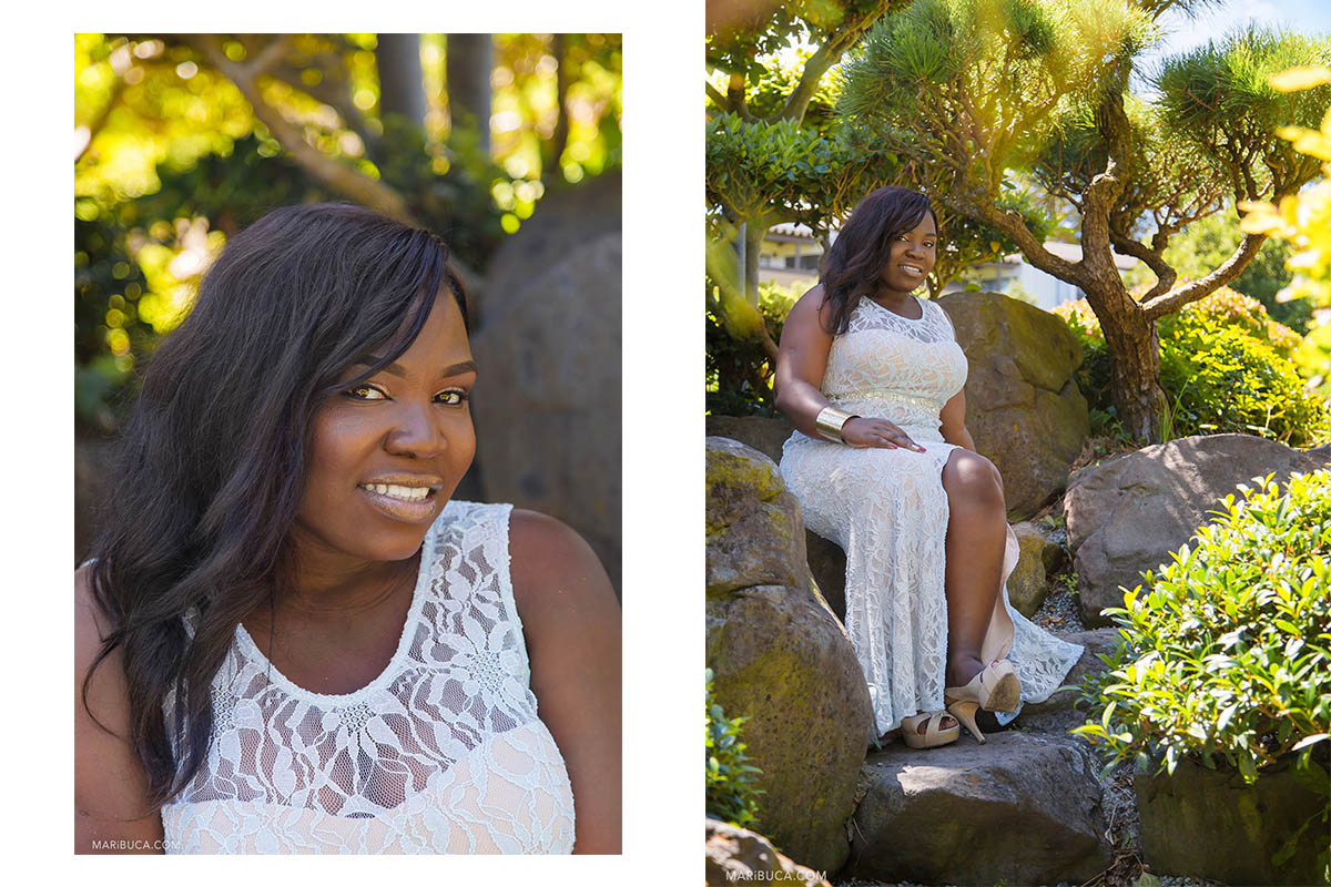 Portrait of the bride with white dress, she is smiling and sitting in the stones in the Hayward Japanese Garden.