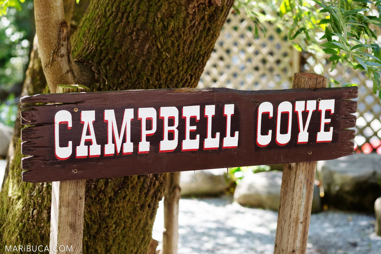 Saratoga Springs Venue - brown wooden sign “Campbell Cove”