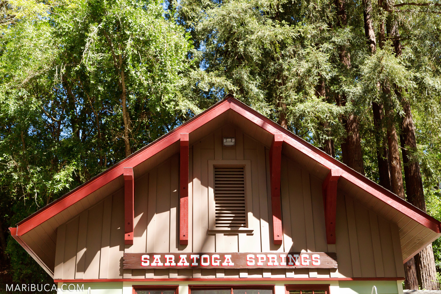 Saratoga Springs wooden sign in the barn with red beans