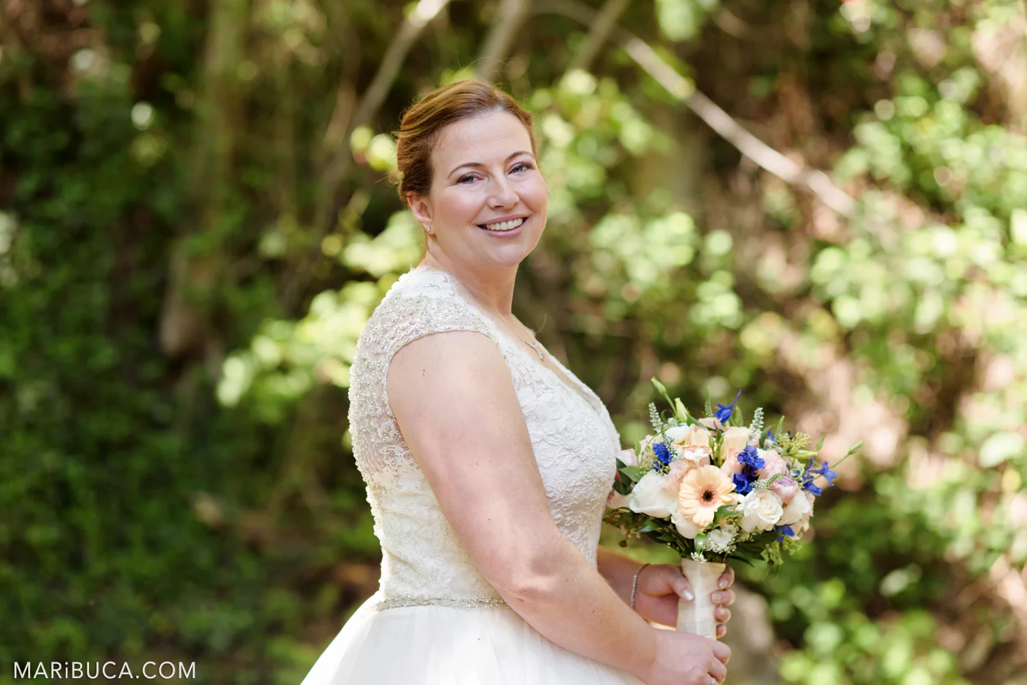 Bride’s portrait, she holds her wedding colorful boquete in the Saratoga Springs Wedding