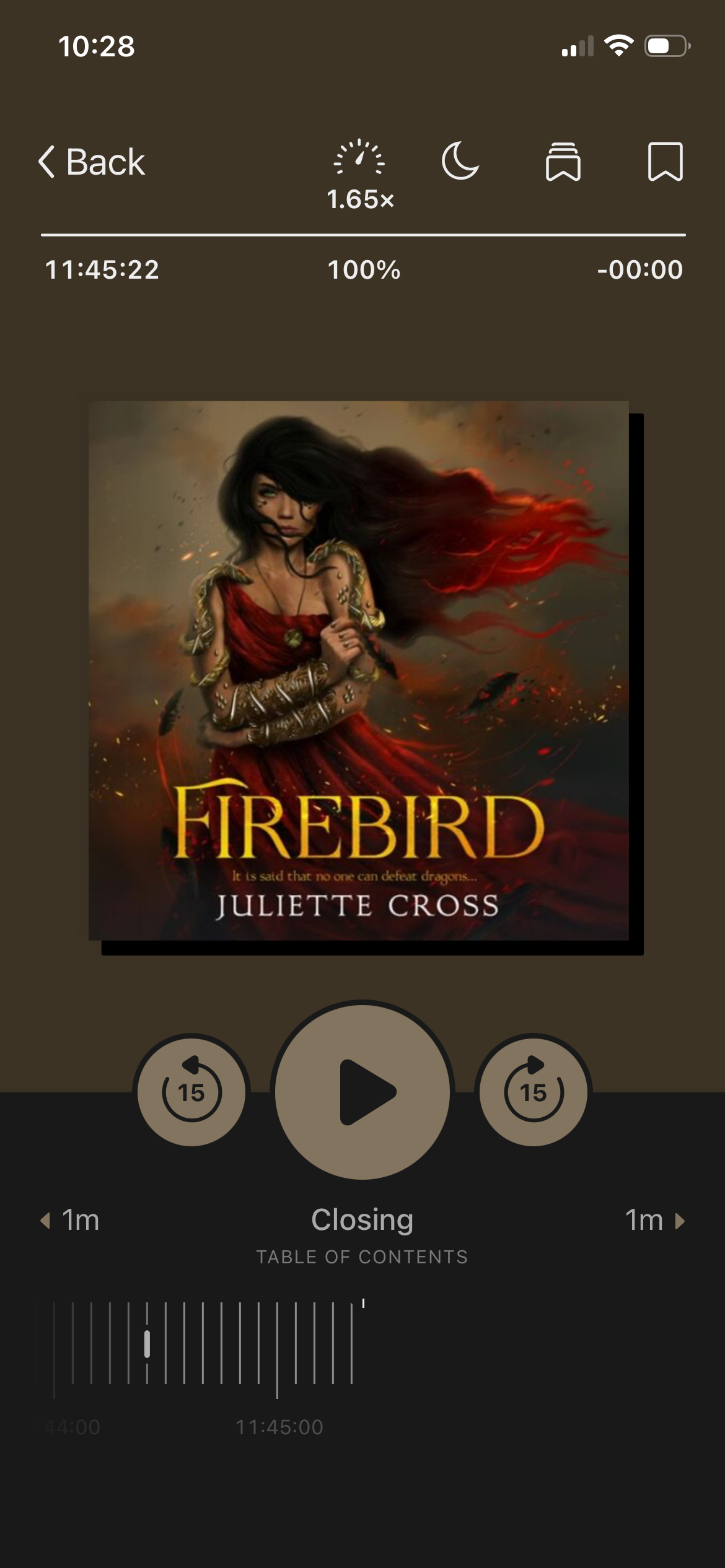 A screenshot of Firebird by Juliette Cross in the Libby app. The cover has a woman with a red dress and long black hair with snakes winding up her arms on it.