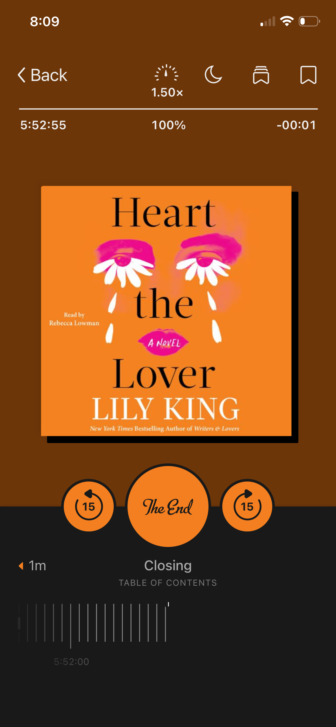 A screenshot of the audiobook Heart the Lover by Lily King in the Libby app. The cover is mostly orange with a pair of pink eyes crying white flower petals.