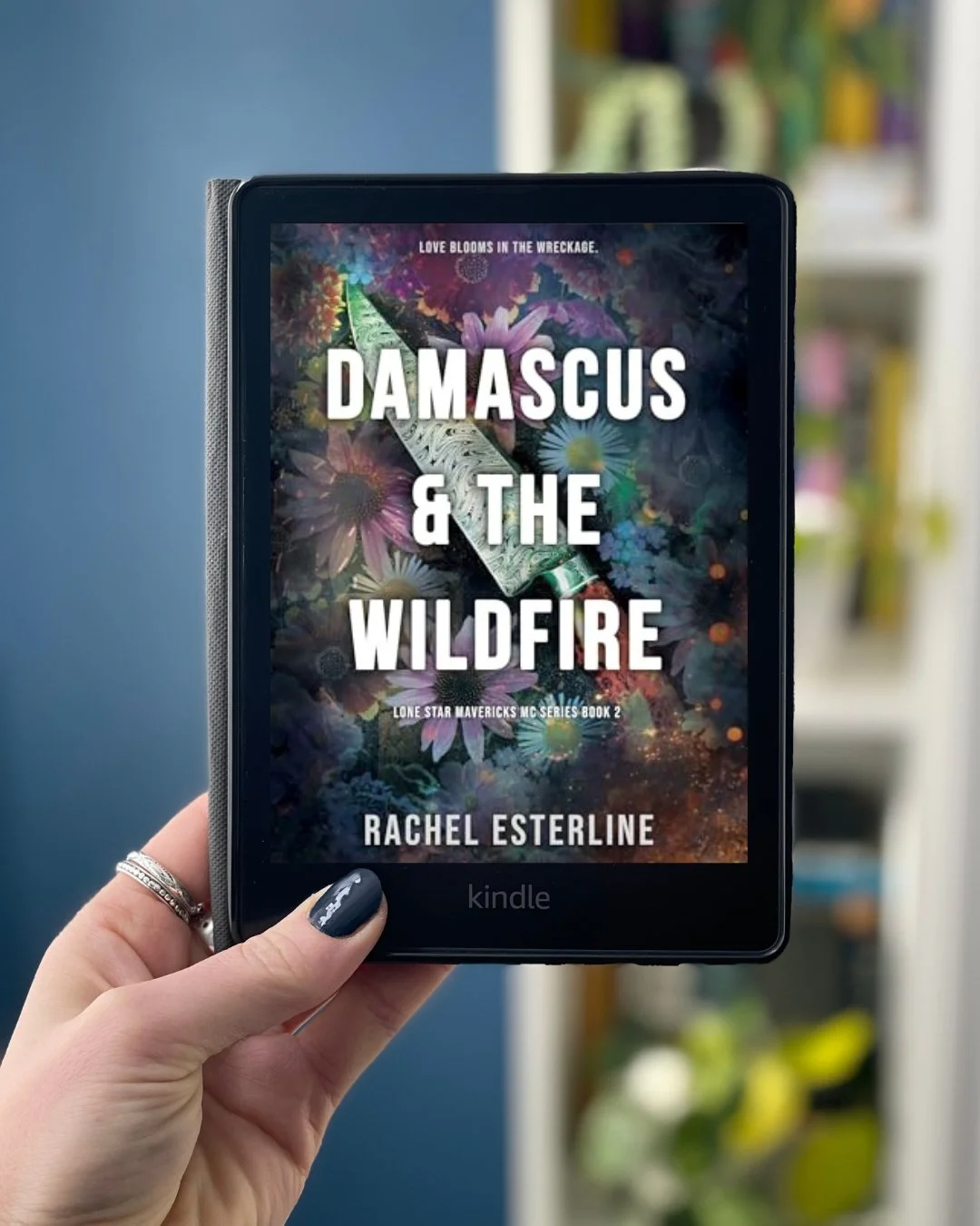 My hand holds a Kindle with Damascus & the Wildfire by Rachel Esterline on the screen.