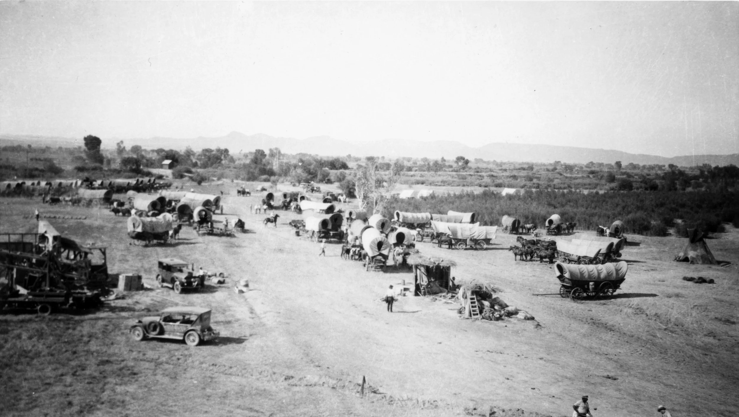 A behind-the-scenes shot from The Big Trail (1930) set in Yuma, Arizona. Photo courtesy of Mrs. Hazel Balinger from The Lapidary Journal .