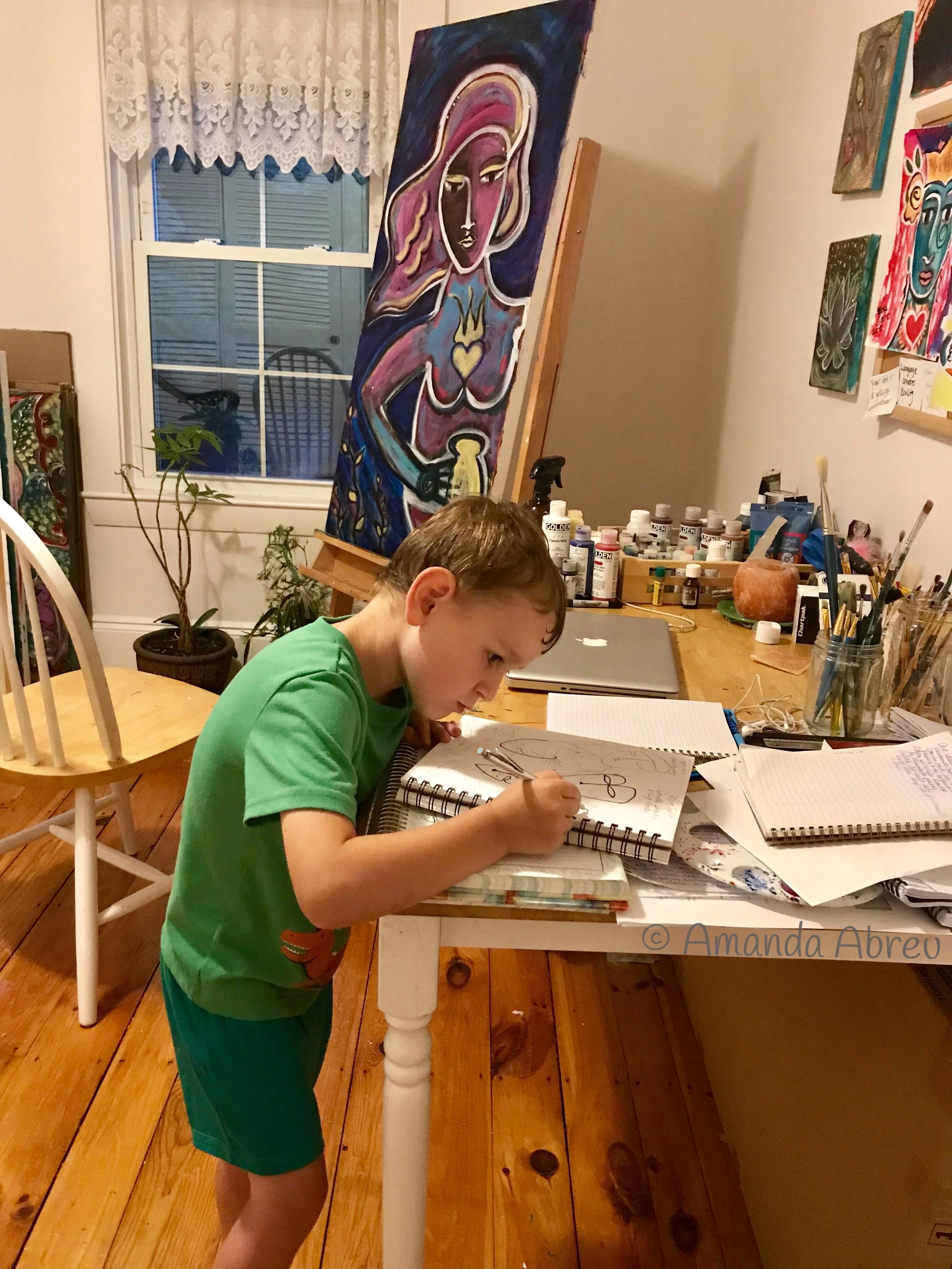 here is my son, naming my paintings.