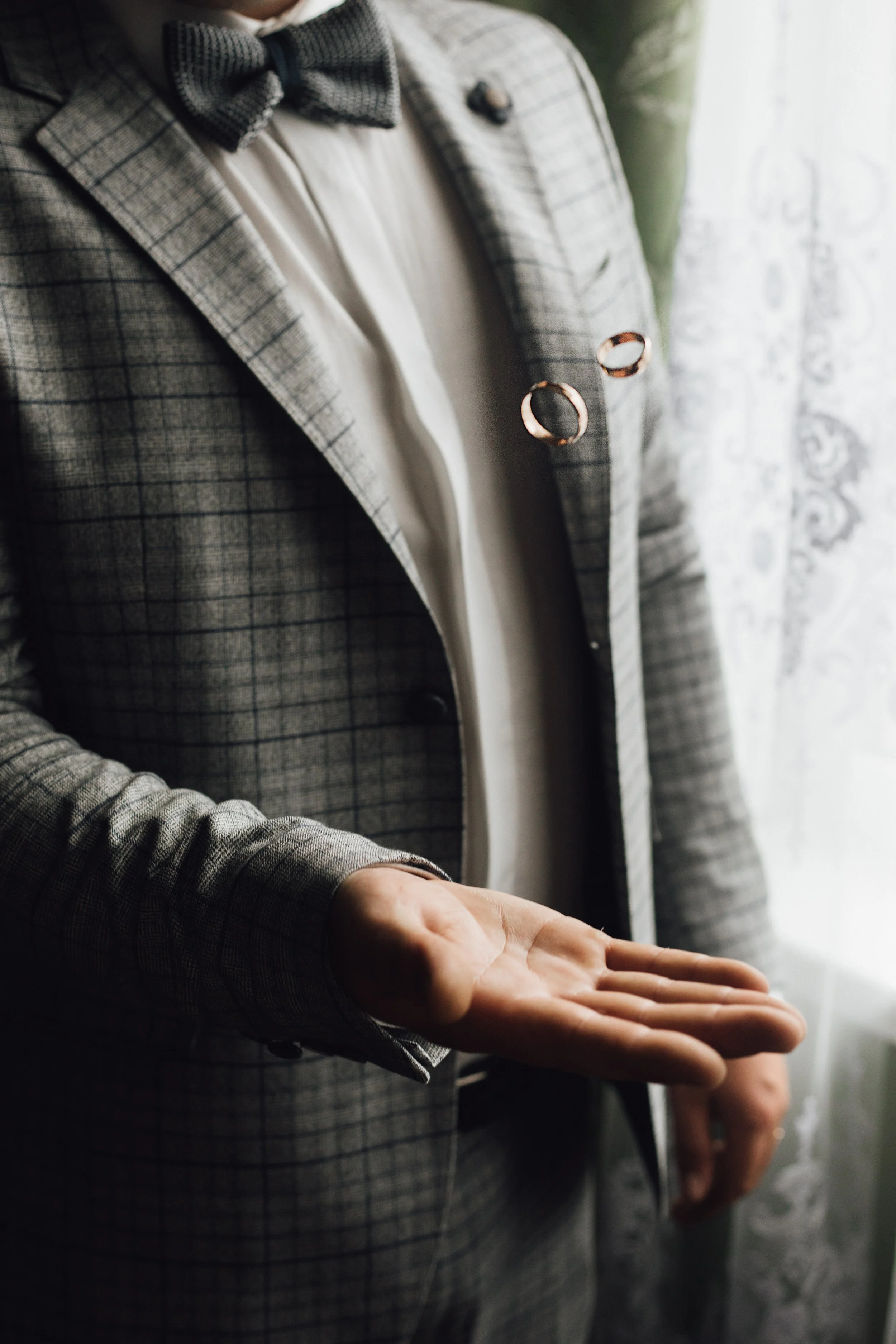 man-is-tossing-two-wedding-rings.jpg