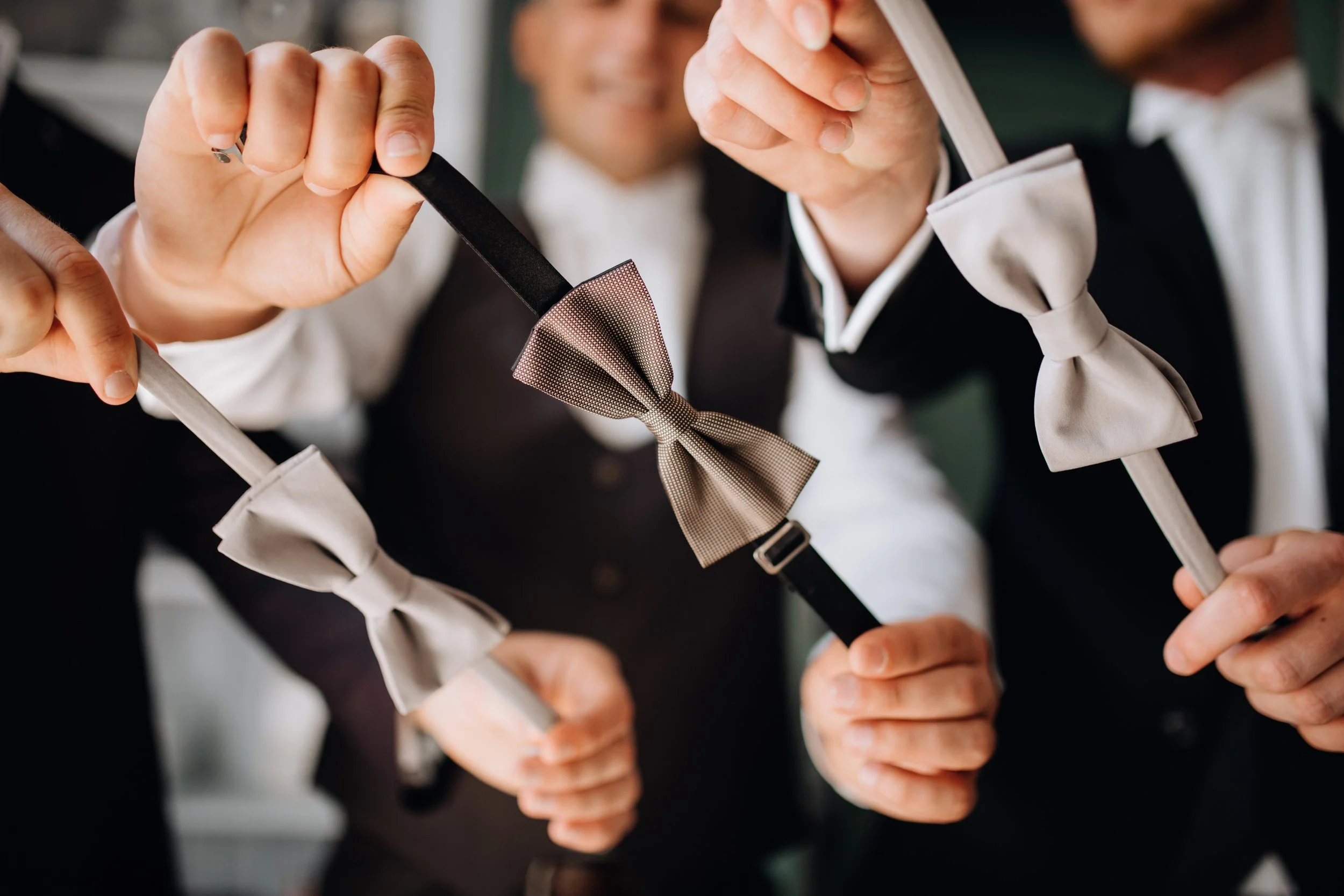 men-demonstrate-their-bow-ties.jpg