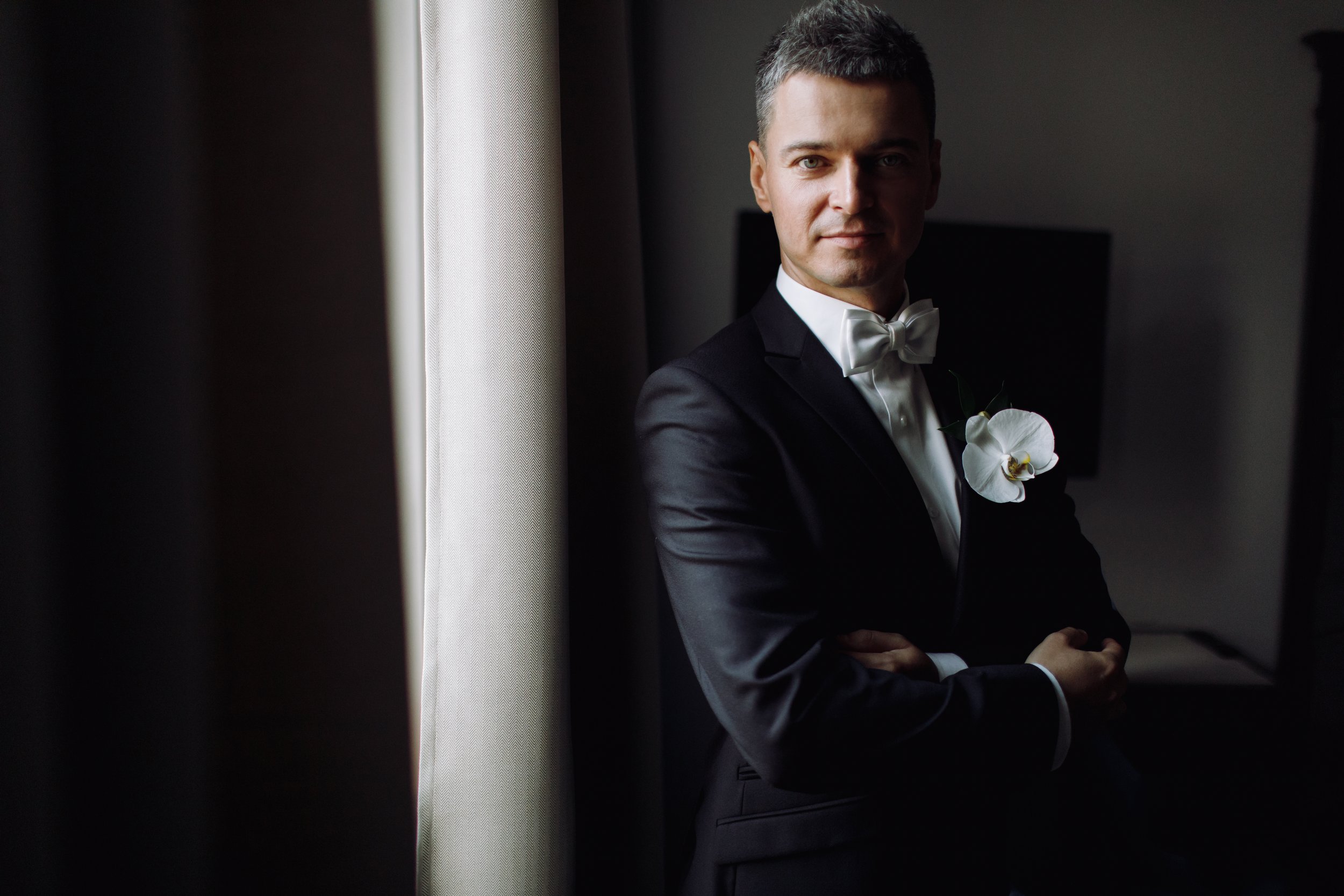 groom-s-morning-handsome-man-black-tuxedo-with-white-orchid.jpg