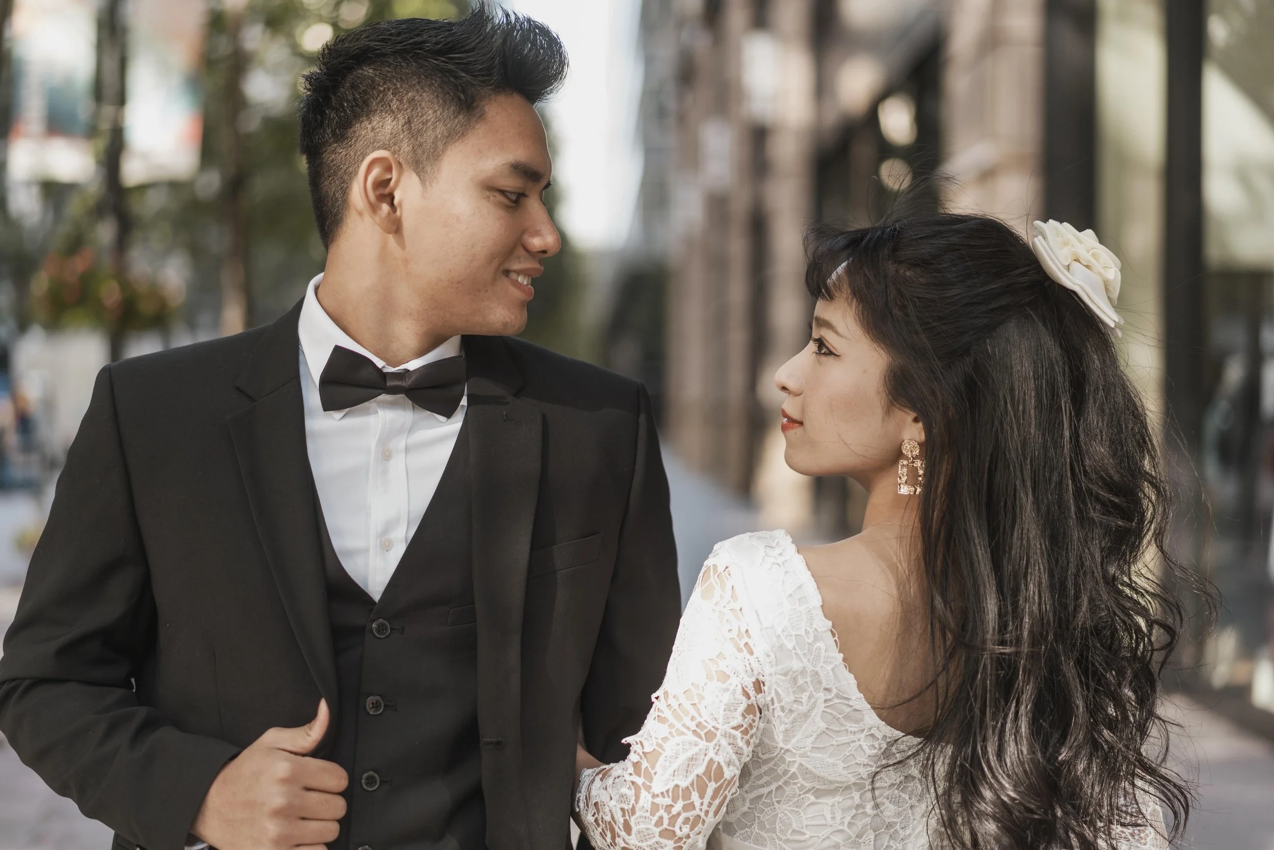 young-newlyweds-posing-together-outdoors.jpg