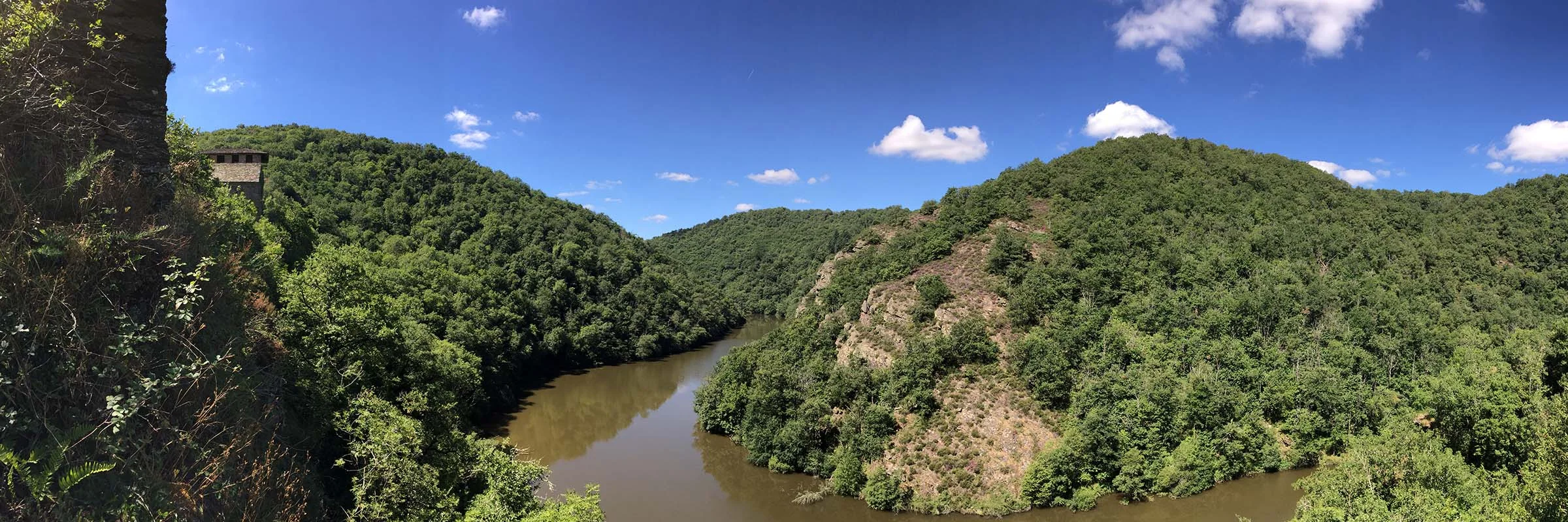 Panoramic view of the Viaur river with Las Plaques overlooking high on the left