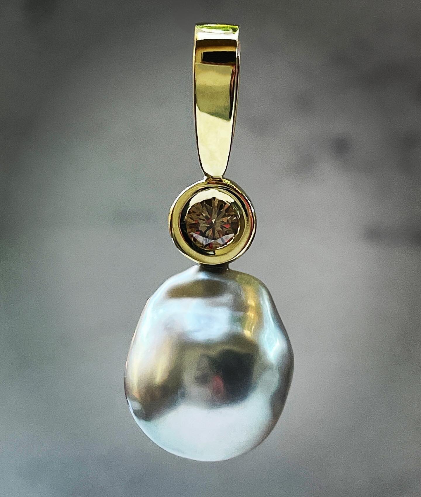 This was a lovely job,  my client wanted to recycle the gold and diamond from her engagement ring, and combine with a beautiful silvery grey baroque pearl purchased by her husband to mark 25 years of marriage, resulting in this elegant pendant.  A lo