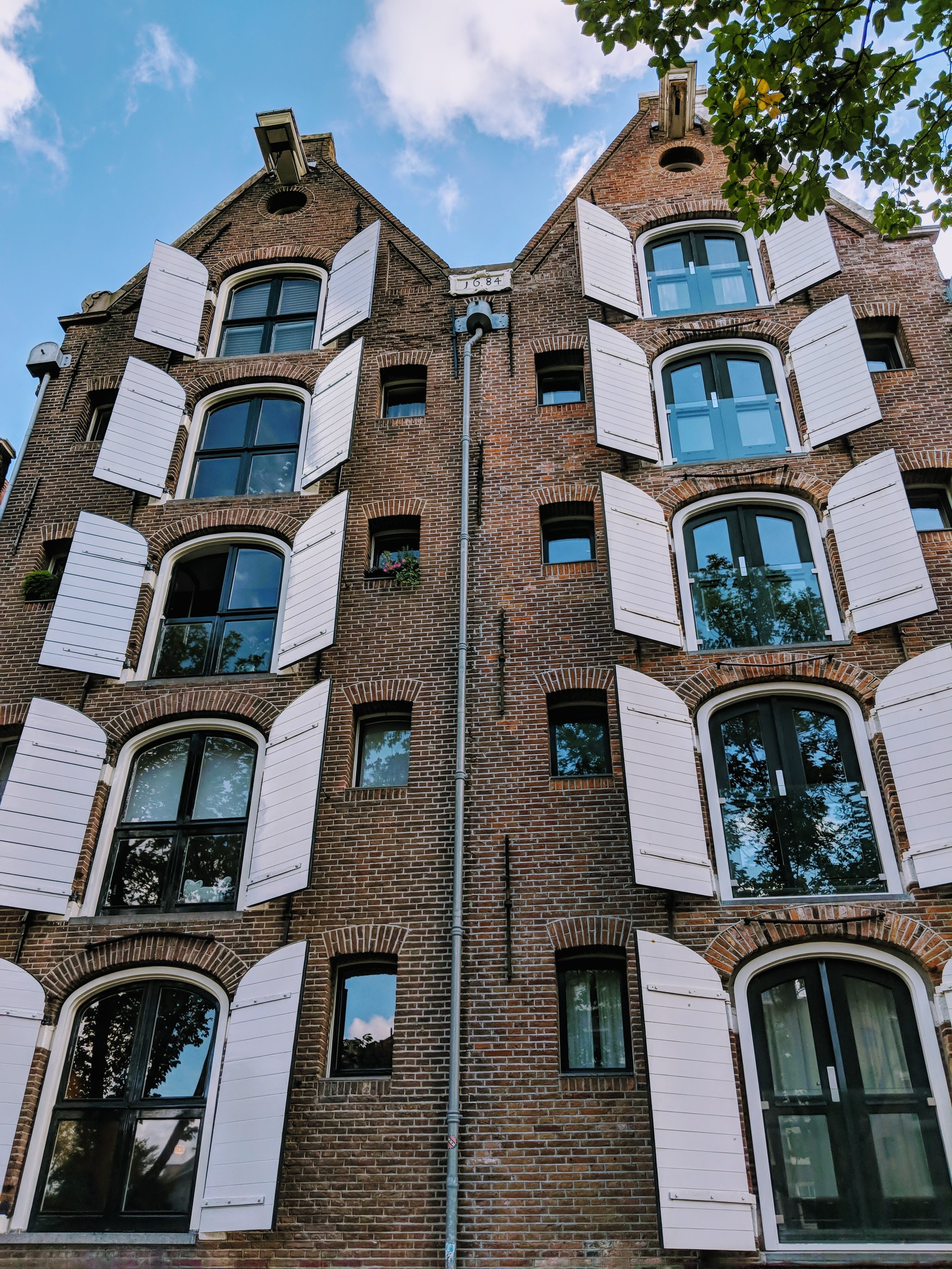 Canal houses with huge windows in Amsterdam