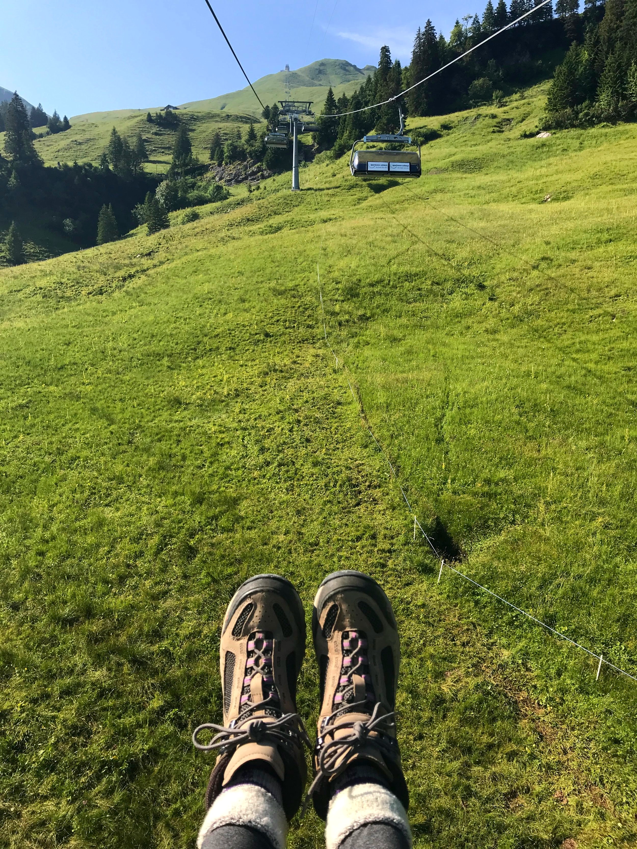 Riding a cable car to the start of the Pizol Five Lakes Hike