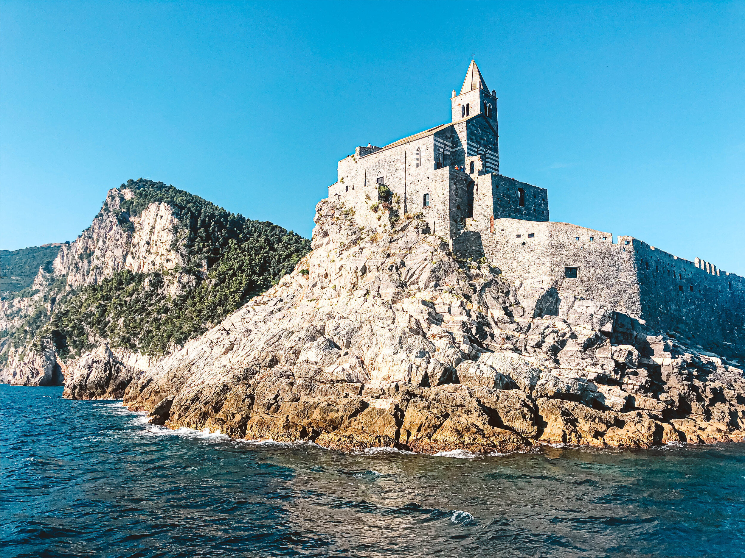 Cinque Terre Portovenere castle from coast.jpg
