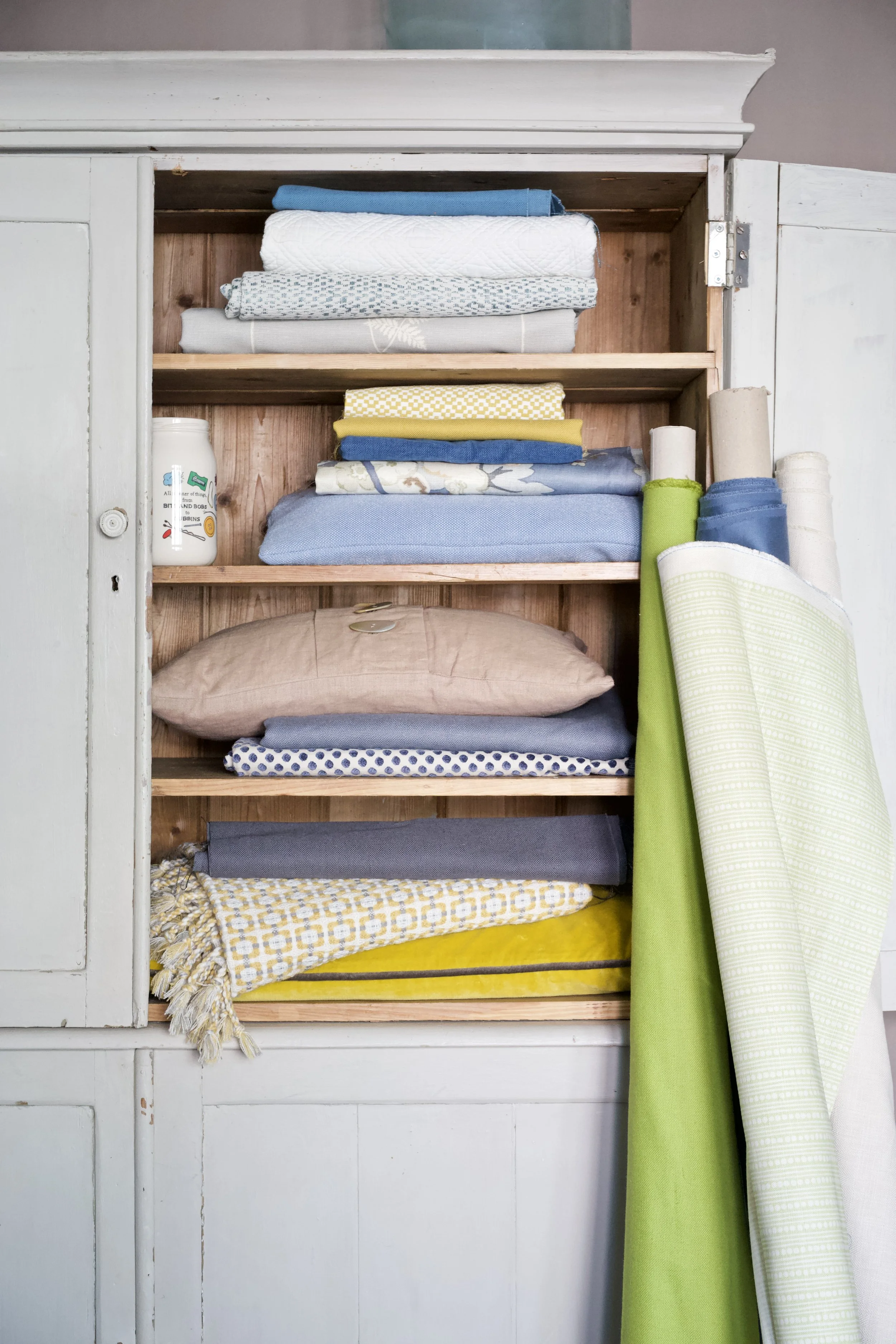 Organised linen storage cupboard