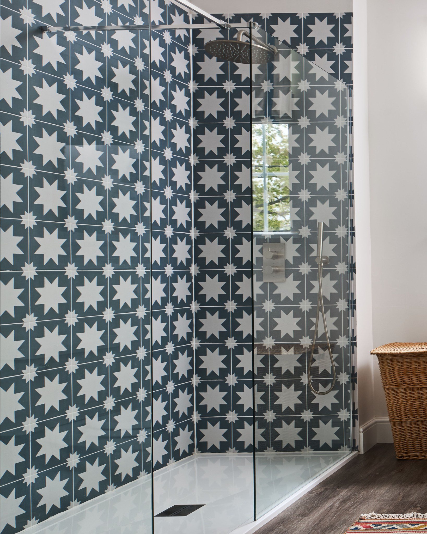 Did we mention we also design bathrooms?

This starry-eyed number is the main family bathroom in a Kent Oast House.

The iconic starburst @capietra Memphis tiles make the spacious walk-in shower feel luxurious and cosy, while a classic stand-alone ba