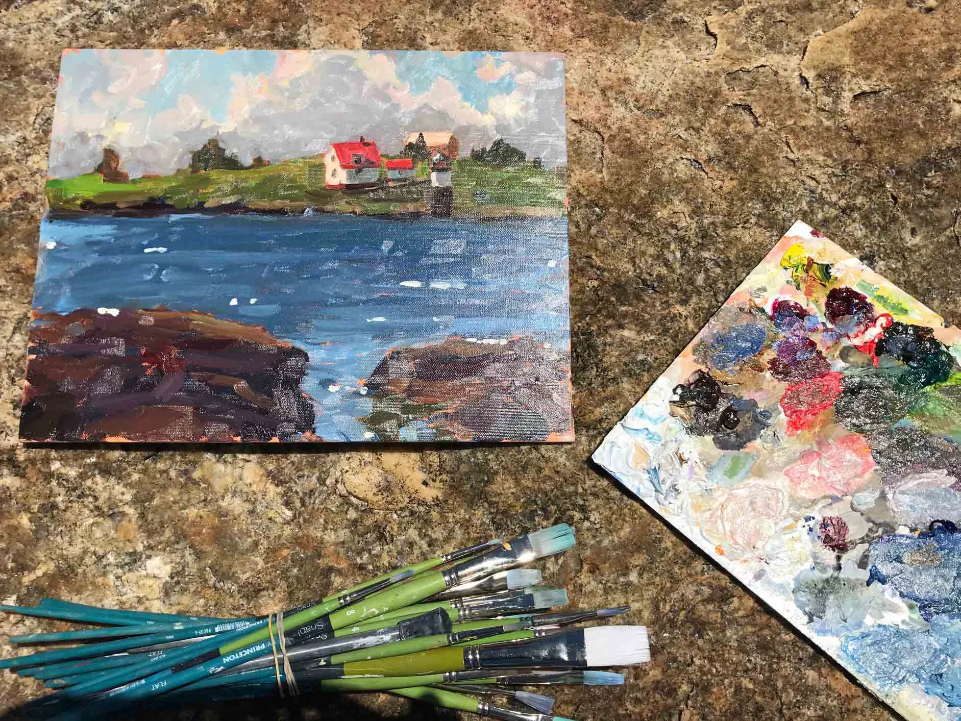 Paintbrushes and paints on the rocks