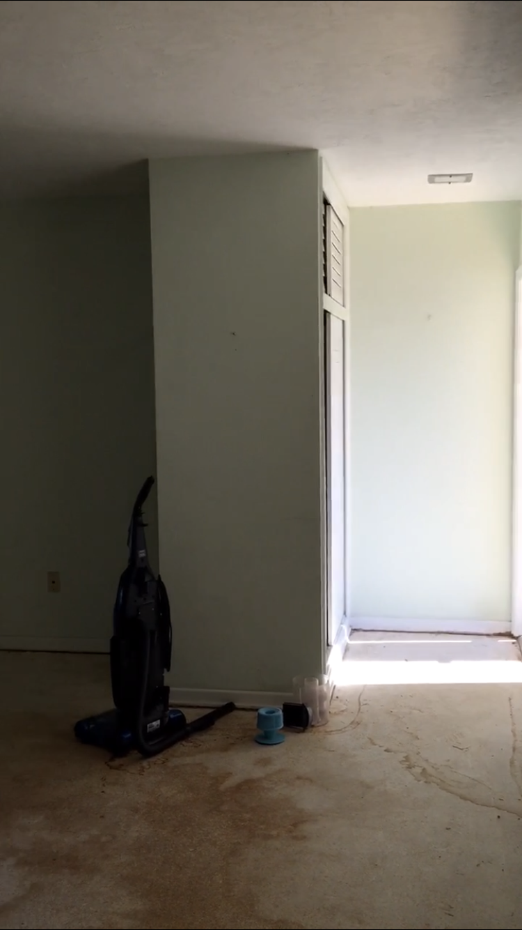  looking back at the entry from the living area/kitchen; you can see the narrow entry with closet 