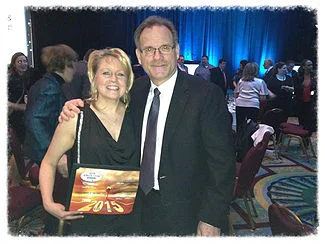 Executive Director of Skate Canada British Columbia/Yukon Territories Ted Barton presenting Joanne McLeod with Coach of the Year award