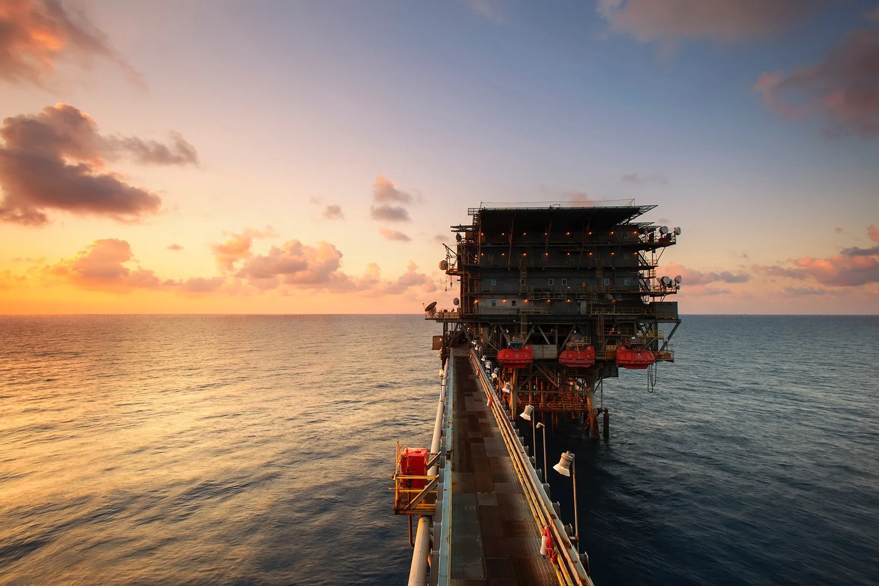 Why is OPEC reducing oil production?