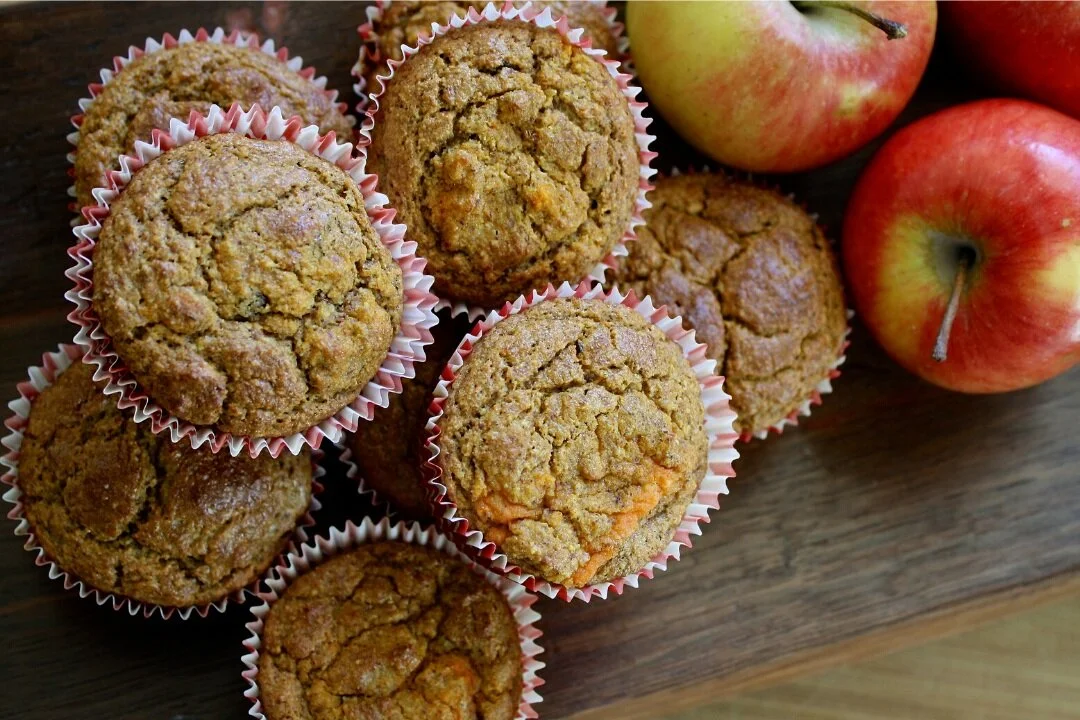 A stack of pumpkin muffins. A postpartum doula St. Louis can help prepare healthy meals and snacks for new parents.