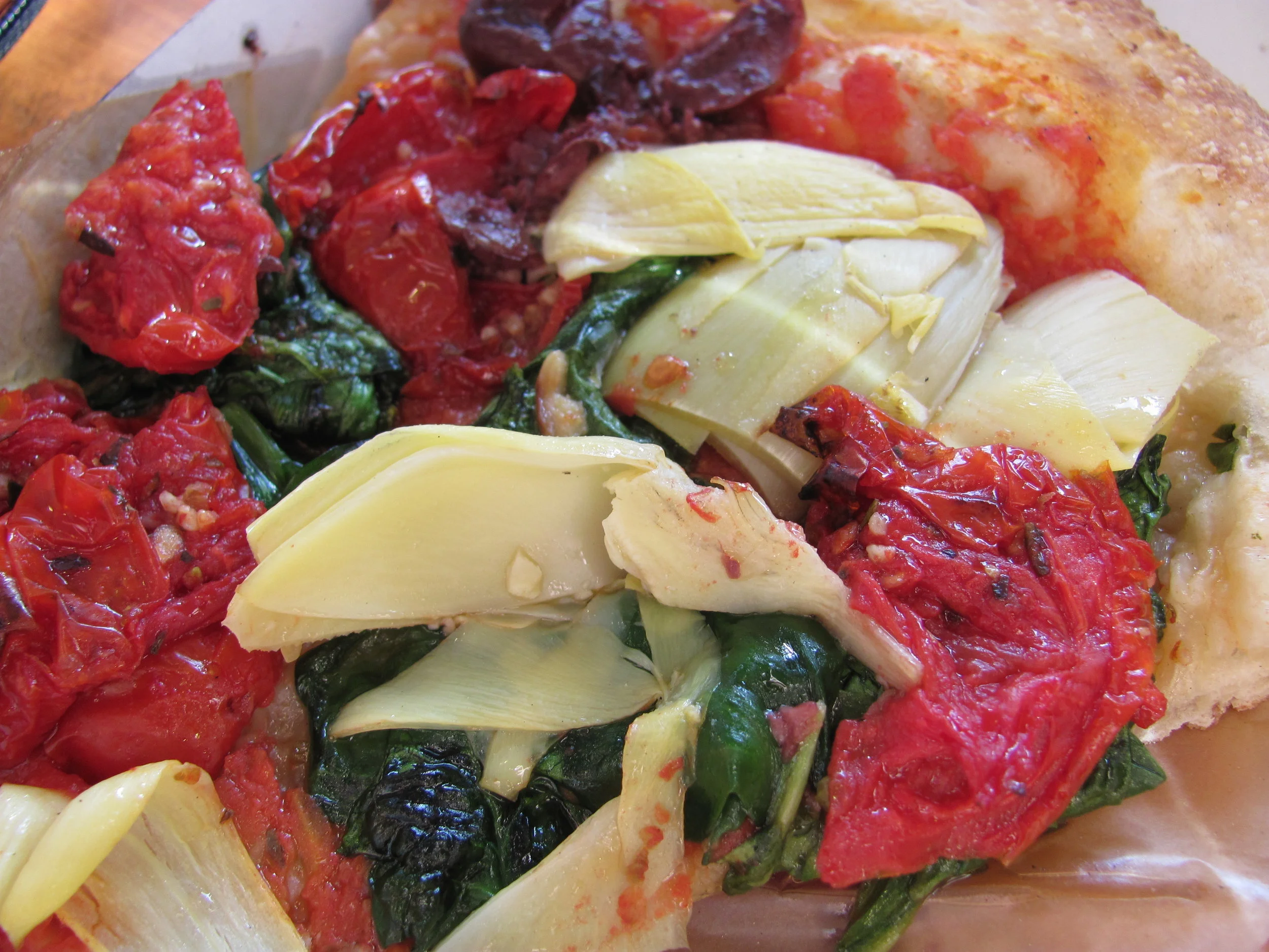 some of those veggies - a vegan pizza slice from Whole Foods Foggy Bottom