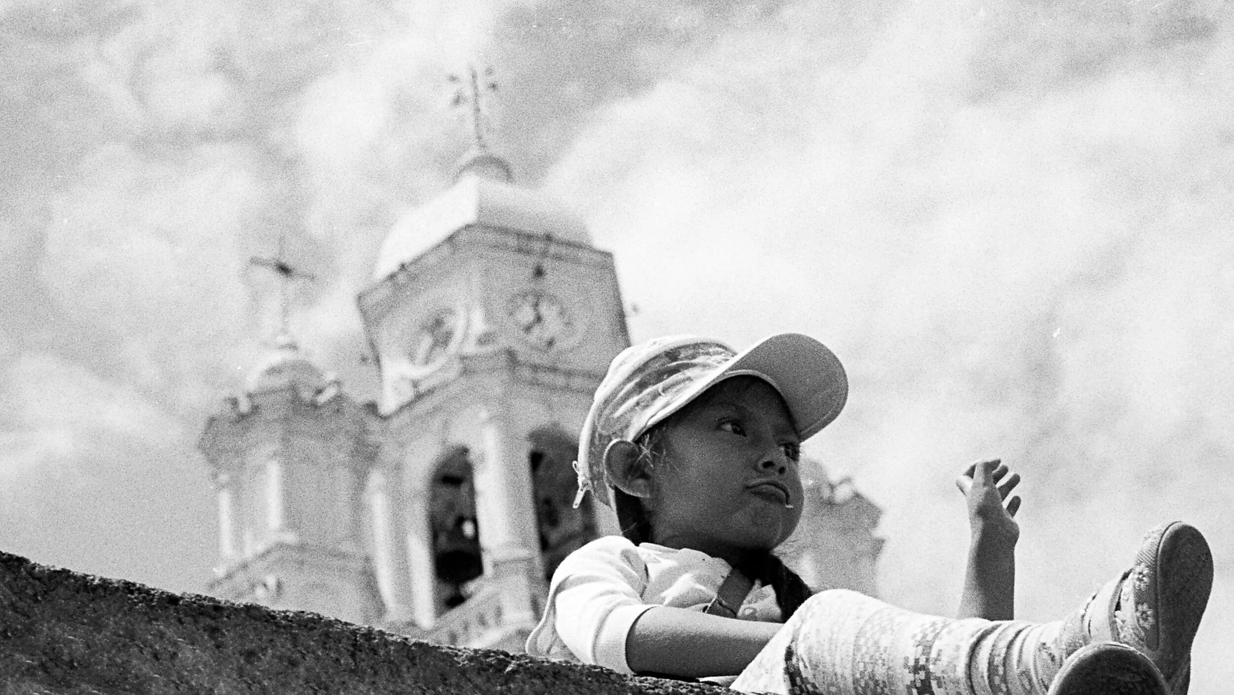 girl on ledge church in background JPEG 2020.jpg