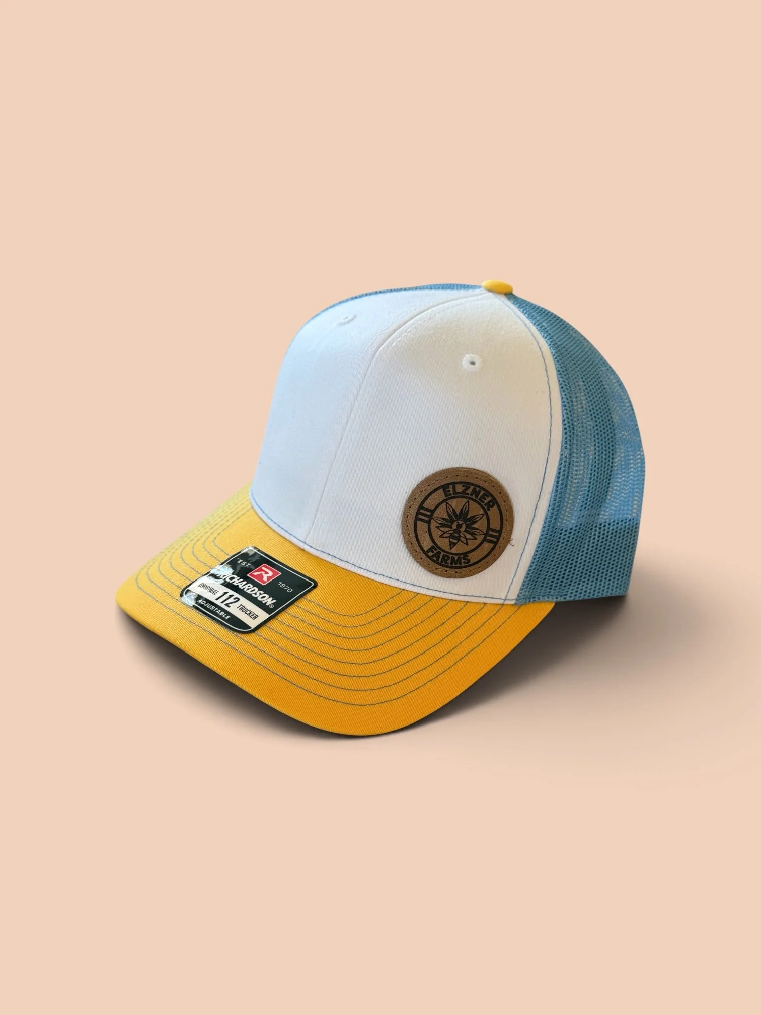 Elzner Farms Hat yellow bill side shot.JPG