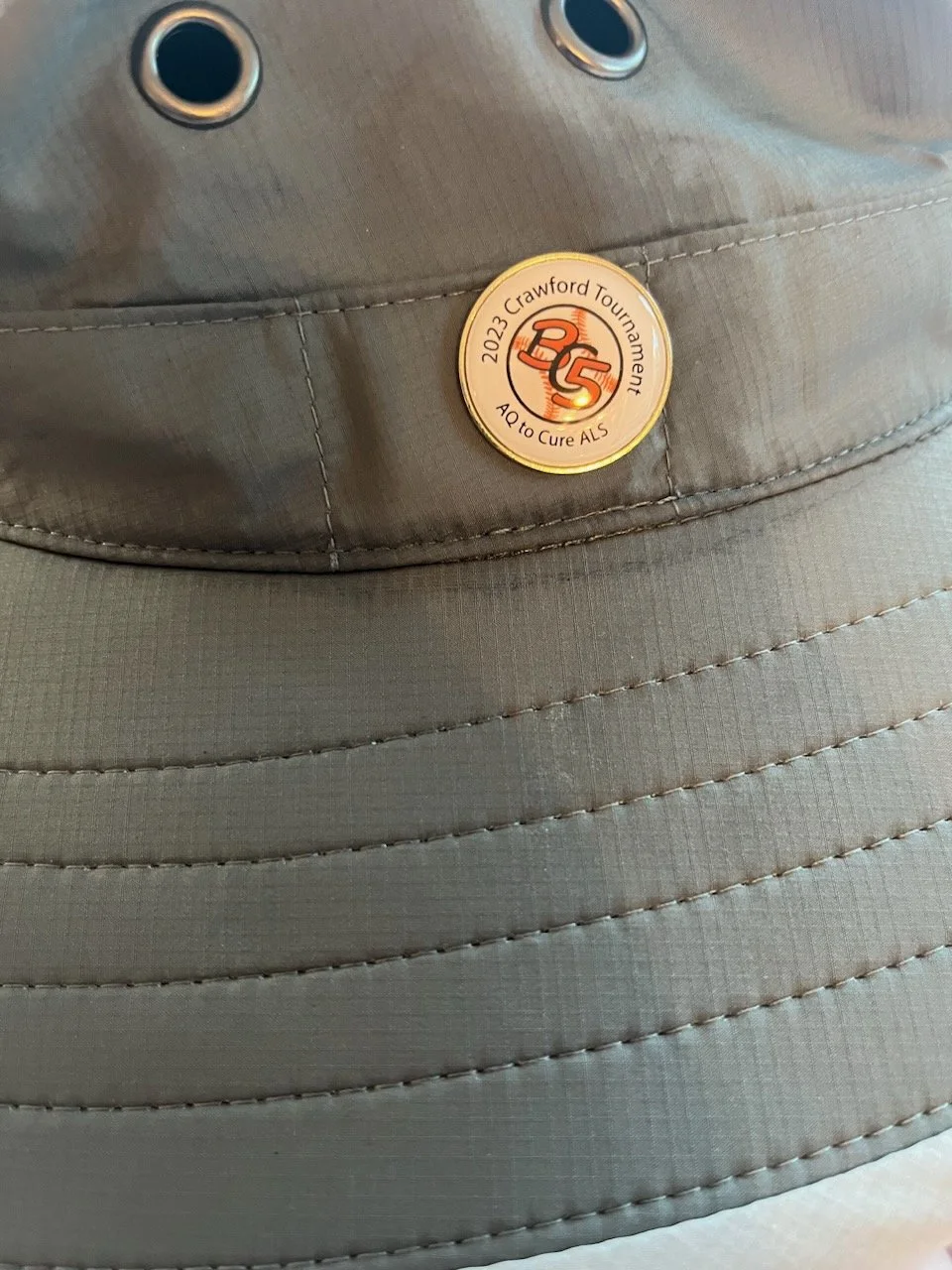 Hat and ball marker tee prize
