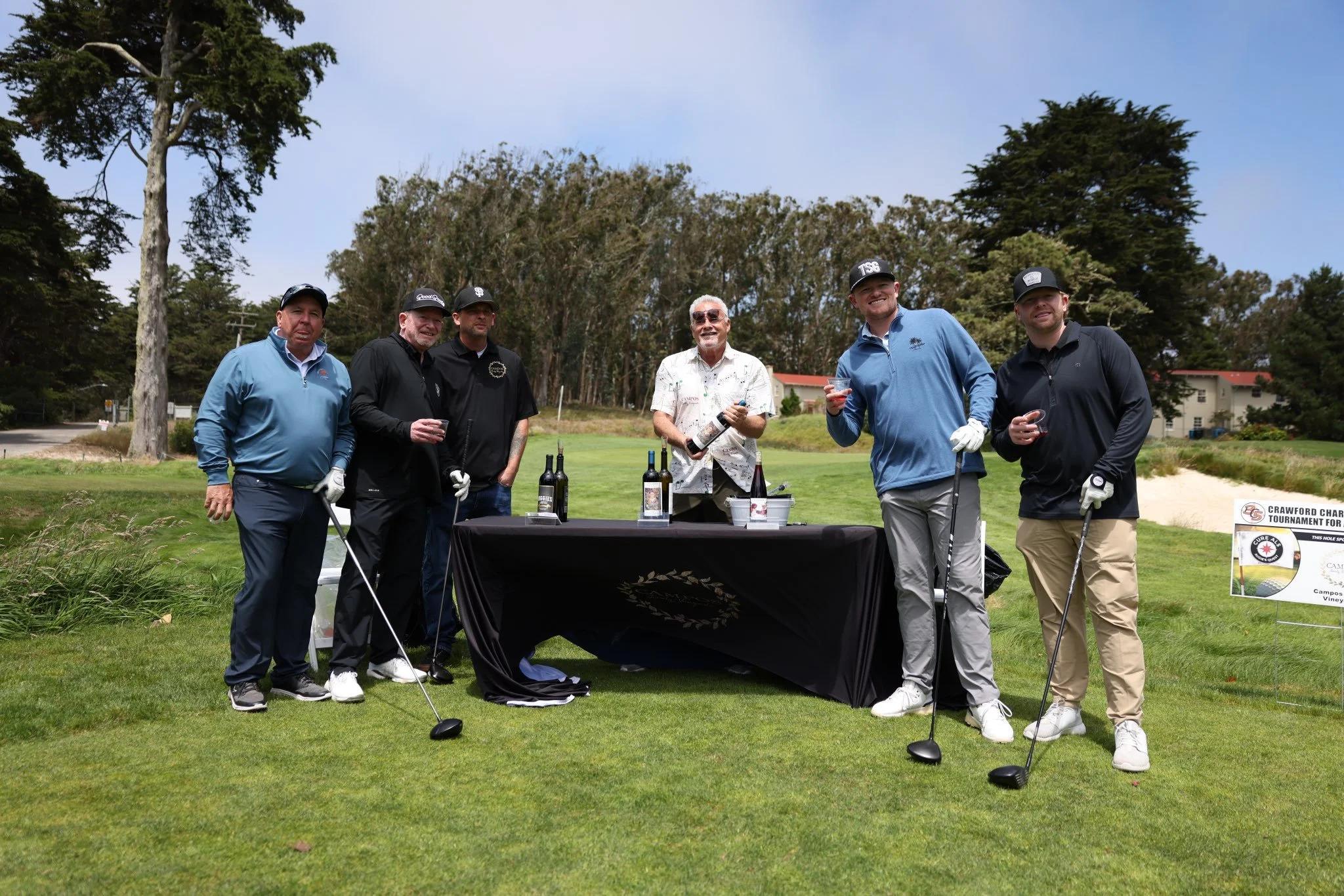 Logan and group visit Campos Vineyards table 