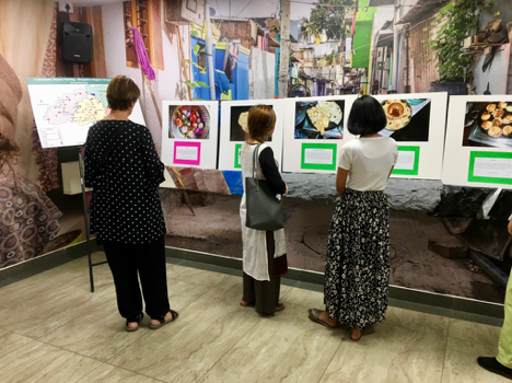 Community exhibition with participant photos and stories