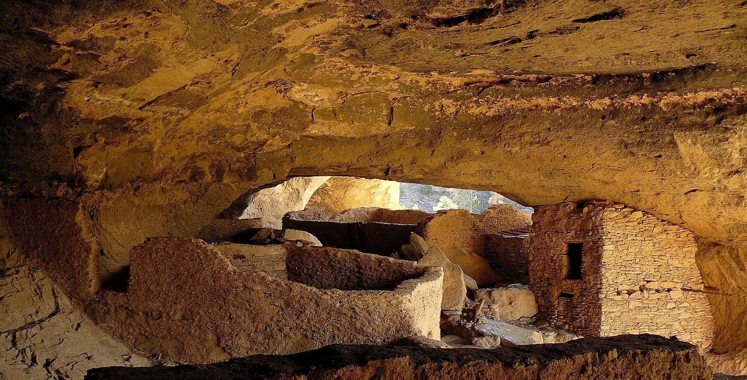 The warm tones of the Hopi and Pueblo cave dwellings. How do we bring this feeling of psychological comfort and shelter to our modern steel, concrete and glass buildings?  