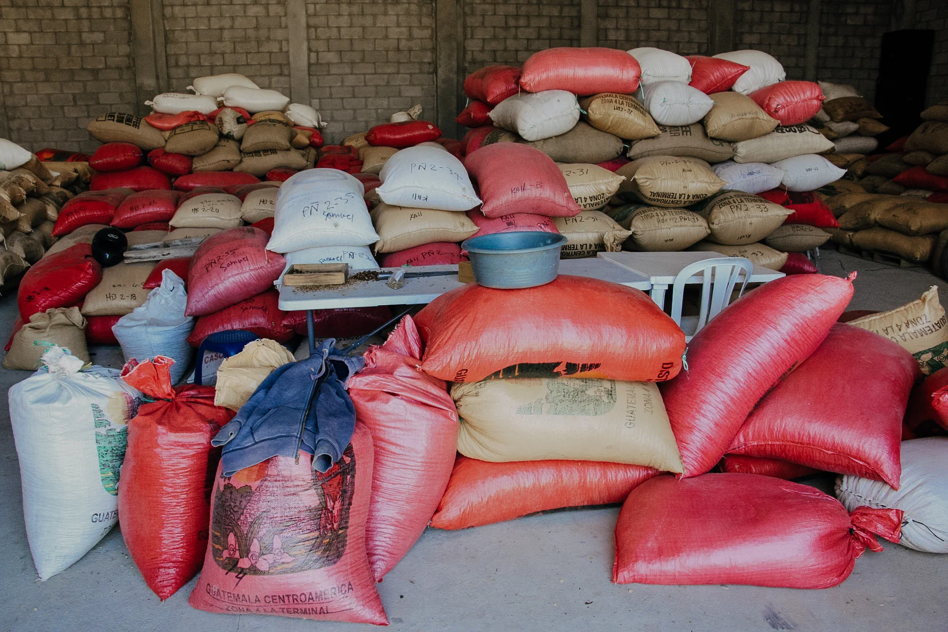 Bags of coffee in parchment awaiting a trip to the dry mill.