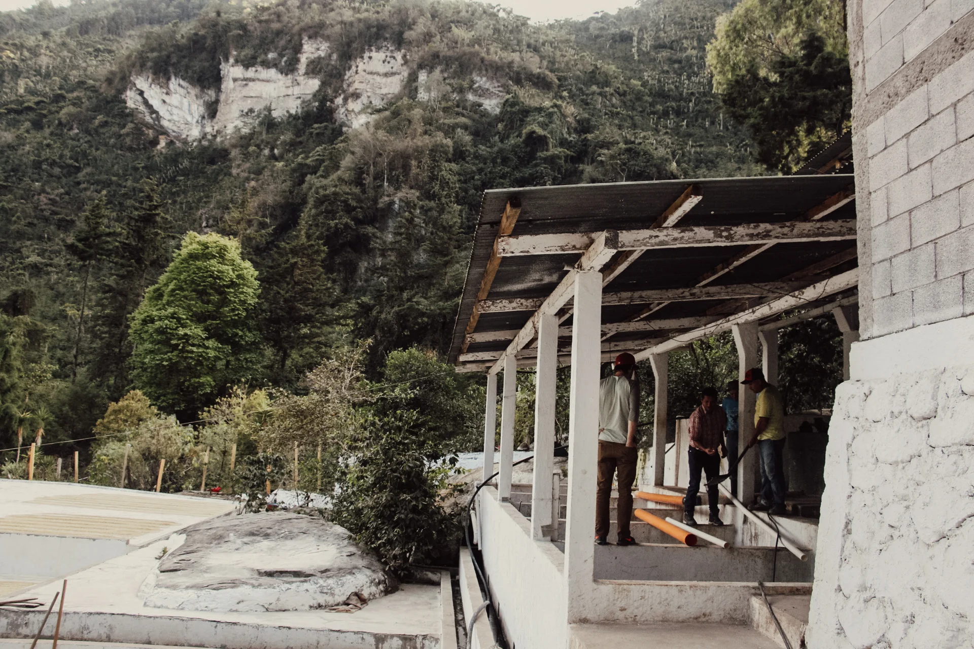 Chalk white cliffs overlook the wet mill and patios at Jenner, Rodin, and Dennis’ new finca.