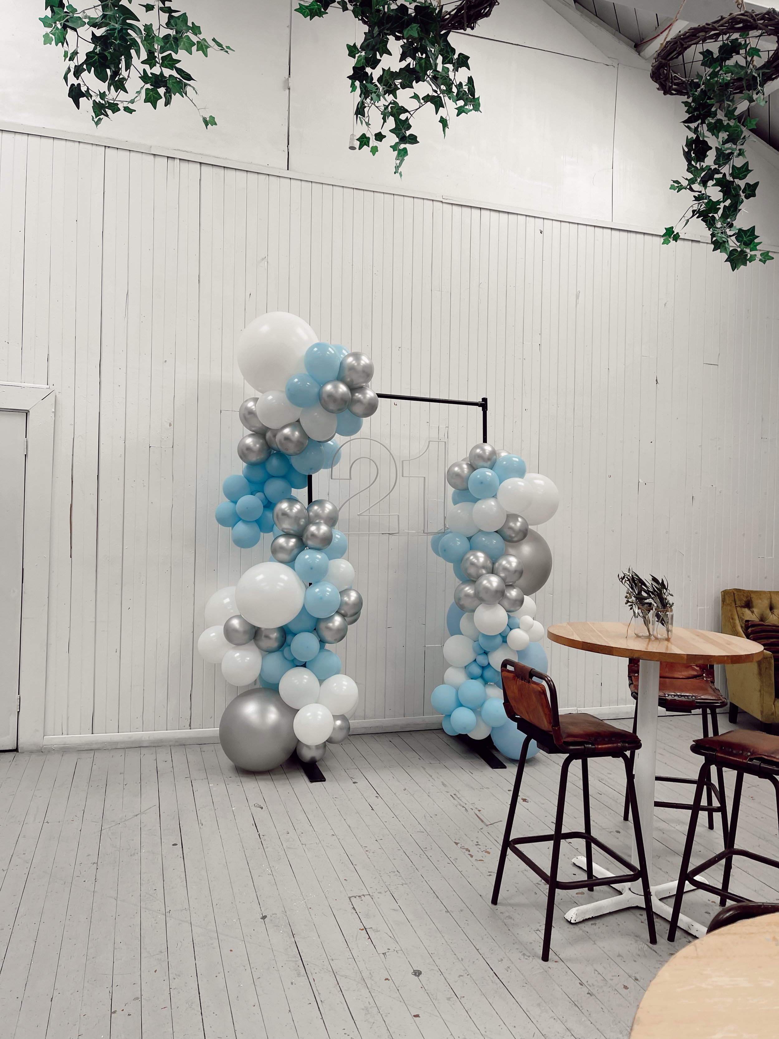 Industrial Frame with balloons and neon 21 at Vault 21.jpg