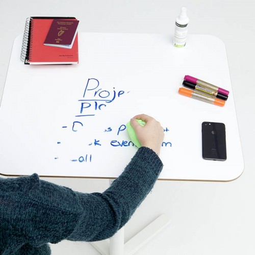 Smart-Self-Adhesive-Whiteboard-Film-creates-writable-desk-which-is-being-erased-using-cloth.jpg