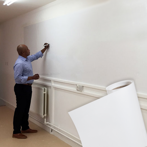 man-using-magnetic-wallpaper-on-wall.png