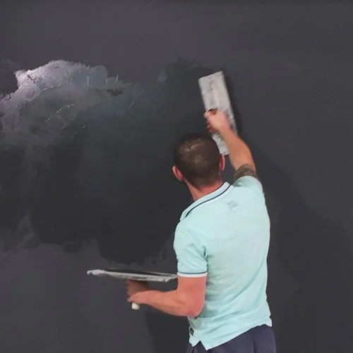 contractor-applying-magnetic-plaster-to-wall.jpg