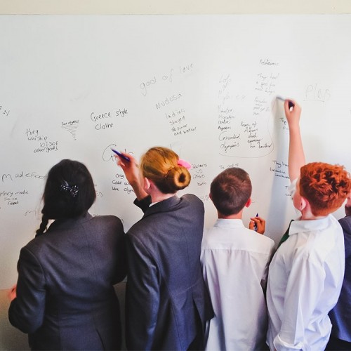 students-in-school-using-whiteboard-wall-in-lessons-painted-in-smarter-surfaces-smart-whiteboard-paint.jpg