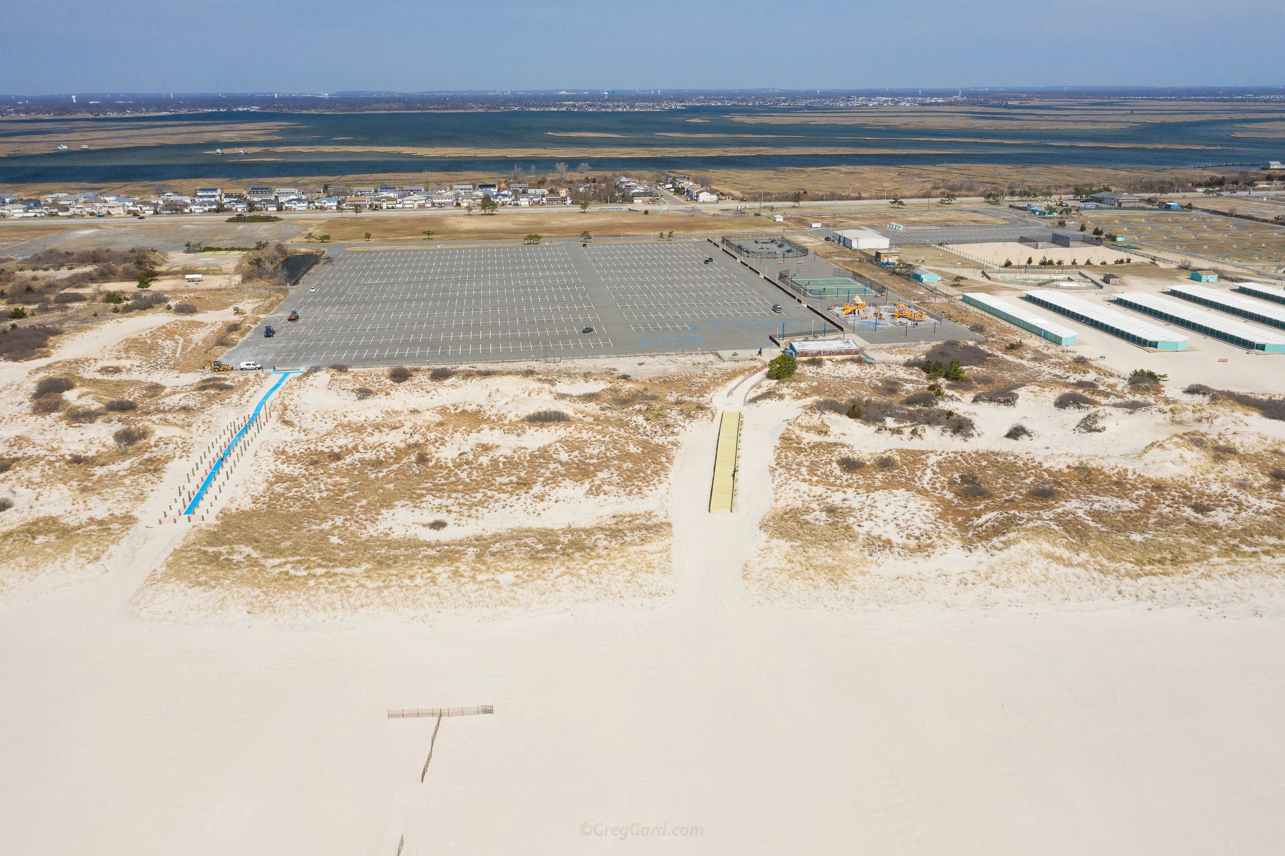 Beach entrances as seen from above - main parking lot at the far distance, bathrooms on the right - Note for the first comers, this is the direction you would be walking back to the parking lot from the beach - Area A on the right