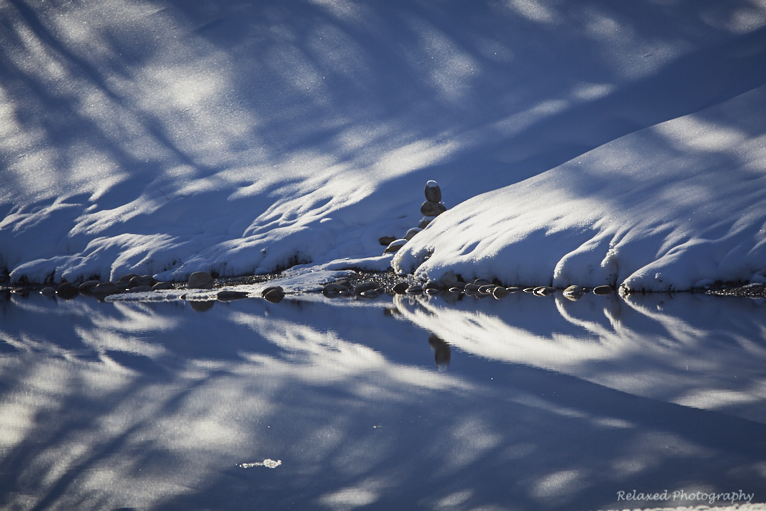 I took these photographs one a day out with my son at a beautiful spot in Kannanaskis country. It was a beautiful day and the light was spectacular. I captured the snow images as we walked around the pond. As we rounded one end of the pond, I was gr