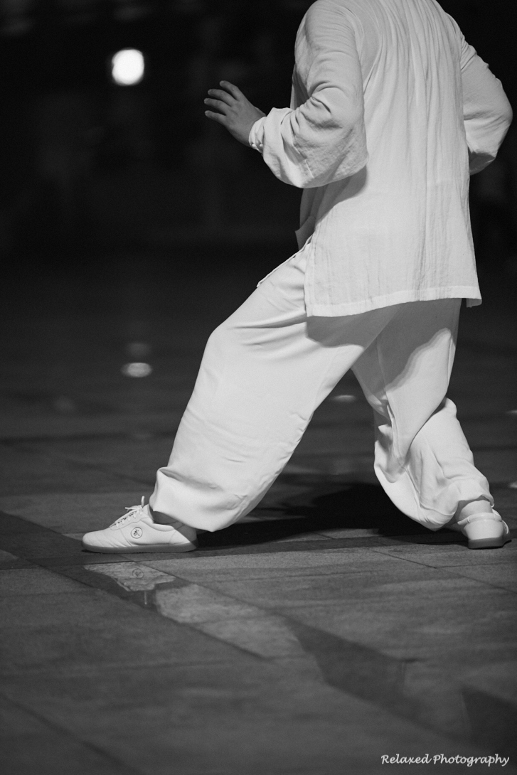 There is an extremely large park close to my home in China, called Shengfung Park and it is used by many, many people day and night. I was down there one evening and came across some folk practising Tai Chi. This is quite common, but in this case th
